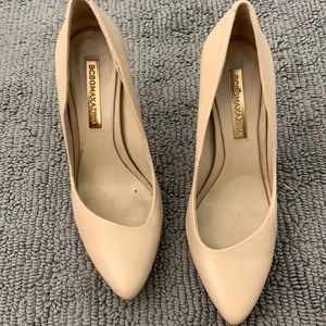 Nude BCBG asymmetric pumps
